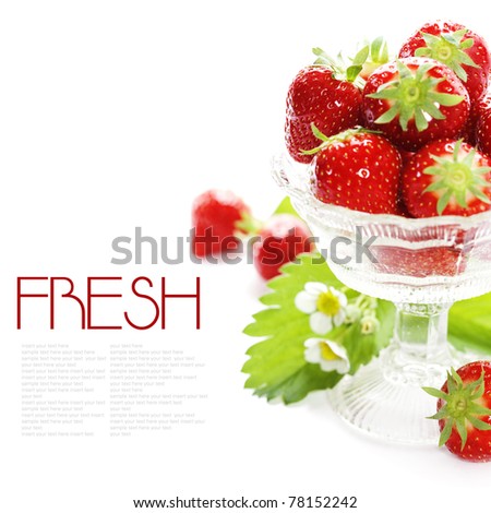 Antique glass filled with fresh tasty strawberries over white (with sample text)