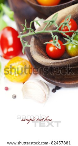 Several varieties of tomatoes over white (with sample text)