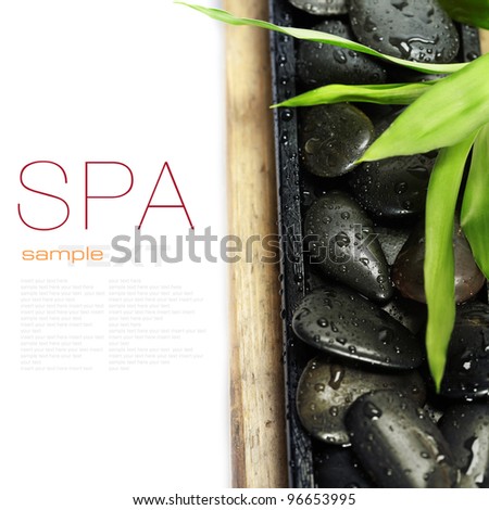 spa concept (zen stones and bamboo) on wooden board - with sample text