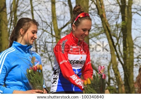 DORDRECHT, NETHERLANDS - APRIL 14 2012: Run Bike Run Bike Run duathlon event. Roos Staps and Lindy van Anrooy on the winners podium of the dualthlon on Saturday 14 April 2012 in Dordrecht.