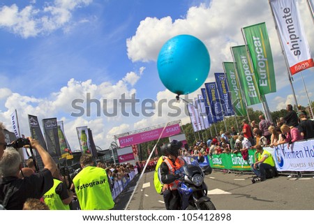 ROTTERDAM, THE NETHERLANDS - JUNE 10 2012: The press wait at the start of the race in the annual Ladiesrun 10 KM event held on Sunday June 10,  2012 in Rotterdam.