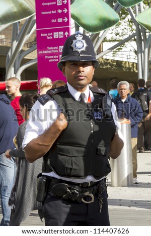 LONDON, UK - AUGUST 5: A London policeman on duty outside Stratford train and metro station on August 5, 2012 in London UK.