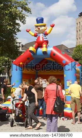 DORDRECHT, NETHERLANDS - JUNE 30: Parents with children playing at the Swan Market on June 30, 2013 in Dordrecht. The lifestyle market was first held in Rotterdam in 2010 and is known for its fun.