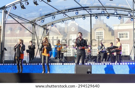 DORDRECHT, THE NETHERLANDS - APRIL 27, 2015: Musical entertainment during the visit of the Dutch royal family on Hollands national Kings day celebrations in the old center of Dordrecht.