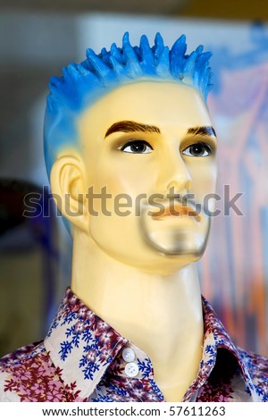Young male mannequin with blue spiky hair