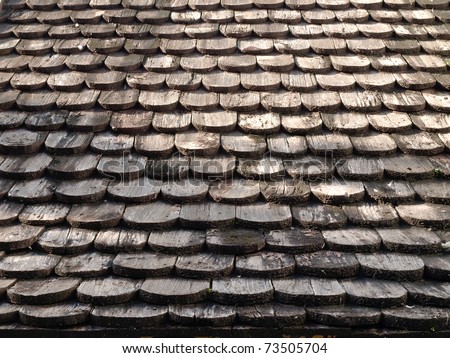 Roof made ??of wood. Close Up Wooden Tile Background