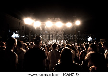 NOVI SAD, SERBIA - JULY 7: Audience infront of the Fusion Stage at EXIT 2011 Music Festival, during Superhiks\' performance on July 7, 2011 in the Petrovaradin Fortress in Novi Sad.