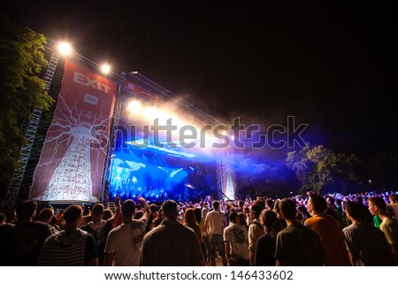NOVI SAD, SERBIA - JULY 10: Audience and rain infront of the Main Stage at EXIT 2013 Music Festival, during Viva Vox\'s performance on July 10, 2013 in the Petrovaradin Fortress in Novi Sad.
