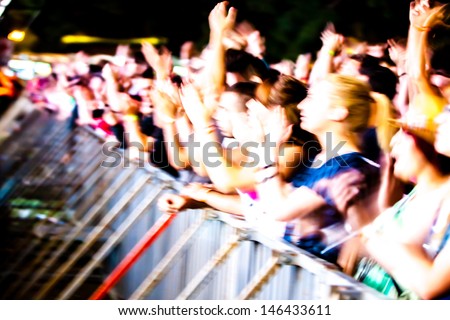 NOVI SAD, SERBIA - JULY 10: Audience (motion blur) infront of the Main Stage at EXIT 2013 Music Festival, during Viva Vox\'s performance on July 10, 2013 in the Petrovaradin Fortress in Novi Sad.