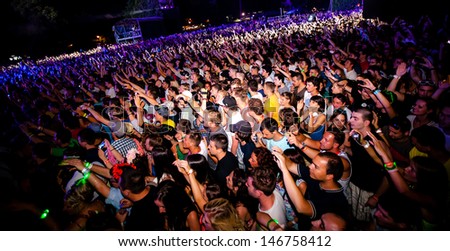 NOVI SAD, SERBIA - JULY 11: Audience in front of the Main Stage at EXIT 2013 Music Festival, during Snoop Dogg\'s performance on July 11, 2013 in the Petrovaradin Fortress in Novi Sad.