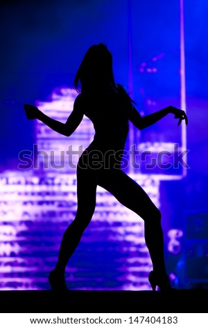 silhouette of a sexy female dancer on stage