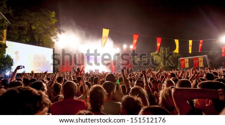 NOVI SAD, SERBIA - JULY 12: Audiece in front of the Main Stage at EXIT 2013 Music Festival, during Prodigy\'s performance on July 12, 2013 in the Petrovaradin Fortress in Novi Sad.