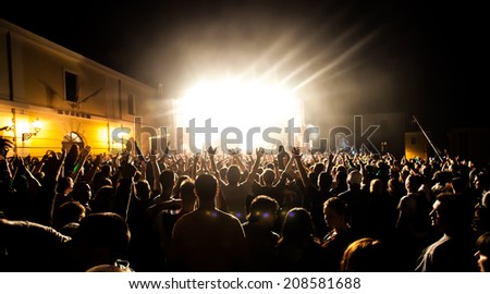 NOVI SAD, SERBIA - JULY 13: Silhouettes of the crowd infront of the Huawei Fusion Stage at EXIT 2014 Music Festival, on July 13, 2014 in the Petrovaradin Fortress in Novi Sad.