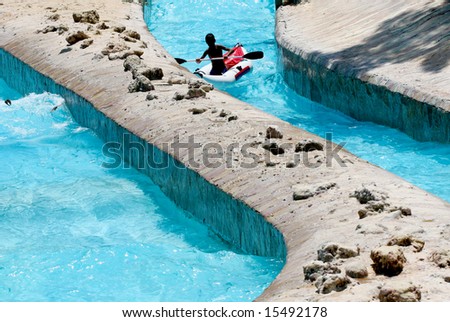 rafting on fake waves in an amusement aqua park
