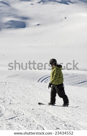 portrait of a boy snowboarding