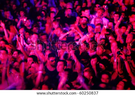 NOVI SAD, SERBIA - CIRCA JULY 2010:Motion blur of audience in front of the Dance Stage at the Best European Music Festival - EXIT 2010, circa July 2010 at the Petrovaradin Fortress in Novi Sad.