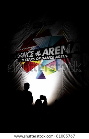 NOVI SAD, SERBIA - JULY 7: People infront of a Dance Arena sign at EXIT 2011 Music Festival, on July 7, 2011 in the Petrovaradin Fortress in Novi Sad.
