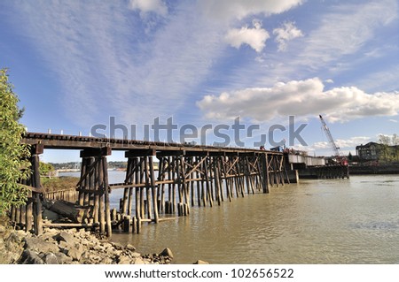 workers repairing railway on a bridge
