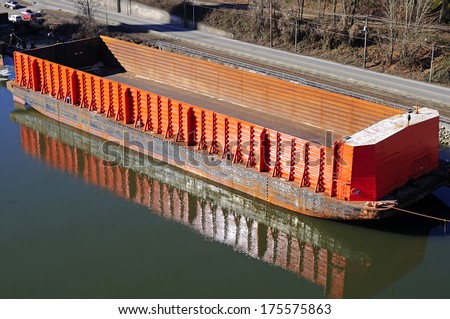 empty cargo boat berthing at riverside