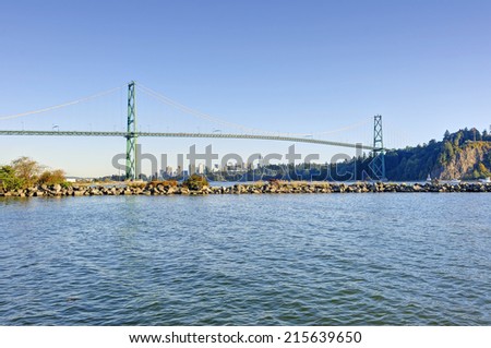 Lions gate bridge from West Vancouver, Canada - with Vancouver city center in the background and a jetty in the foreground
