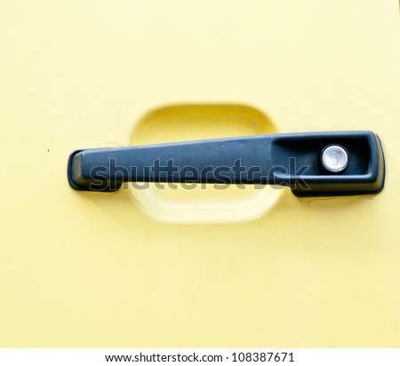 car handle on yellow  background