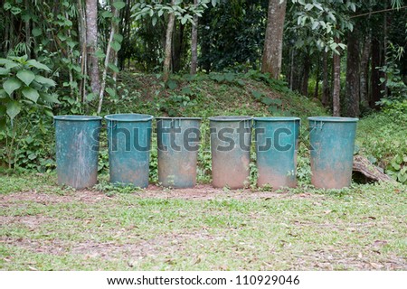 Dirty garbage tanks in forest
