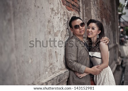 Retro couple at old background