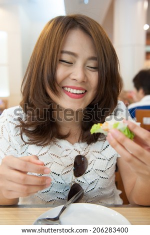 young woman eating vietnam food