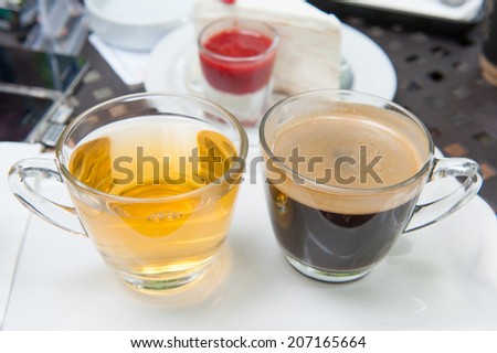tea and coffee cups with cake