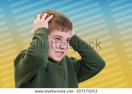 Boy Holding His Head in Pain or Anger