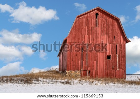 Old Red Barn in Field with Snow