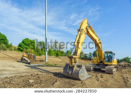 Backhoe Clearing a Building Site