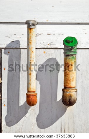 Old Oil Fill Pipes on Wall