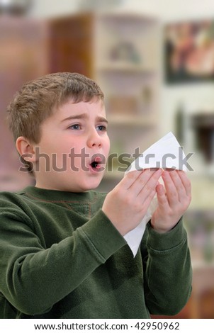 Boy with Tissue about to Sneeze