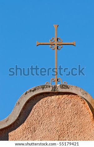 Ornate Cross on Stucco Church