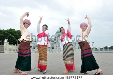 BANGKOK, THAILAND - OCTOBER 2: Unidentified women perform a Thai traditional dance during a traditional merit parade of northern territory of Thailand, October 2, 2011 in Bangkok, Thailand.