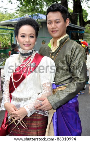BANGKOK, THAILAND - OCTOBER 2: Unidentified Thai lady and gentleman in traditional dress during a parade of people from the northern territory of Thailand, October 2, 2011 in Bangkok, Thailand.