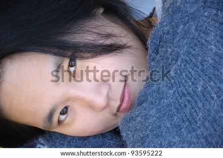 Close up of Asian woman lying down
