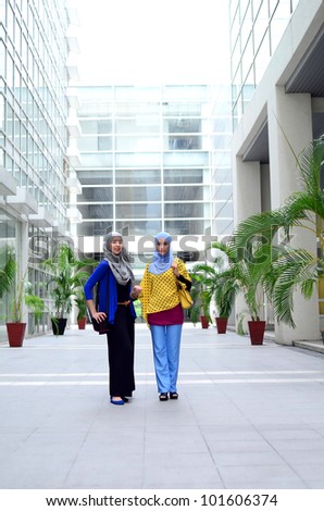 young asian Muslim woman in head scarf walk together