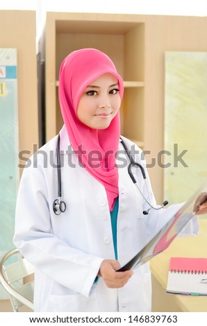 Confident Muslim doctor smile