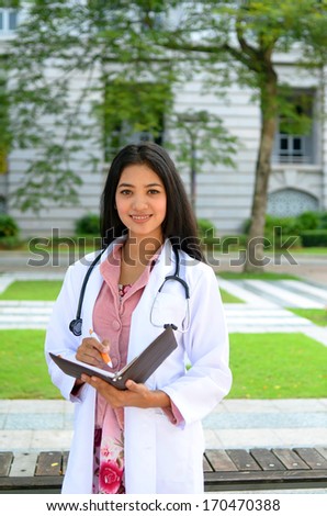 Young asian muslim doctor smile outdoor