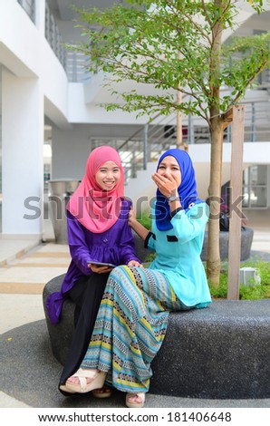 Young asian muslim woman in head scarf smile happy together