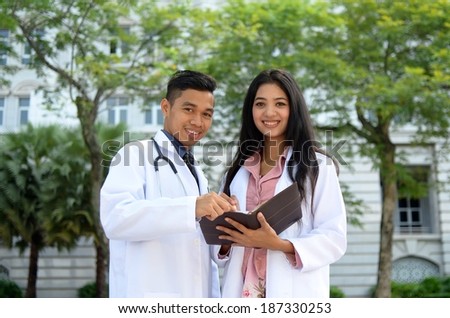 Confident Muslim medical student busy conversation
