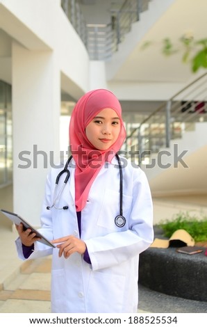 Confident Muslim medical student busy conversation at hospital