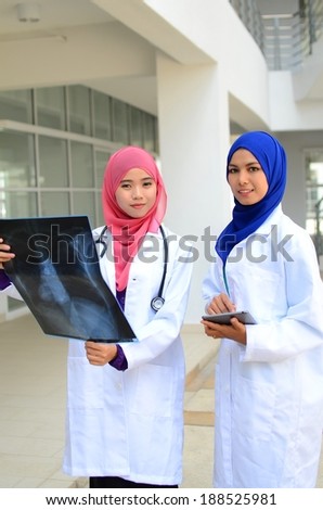 Confident Muslim medical student busy conversation together at hospital