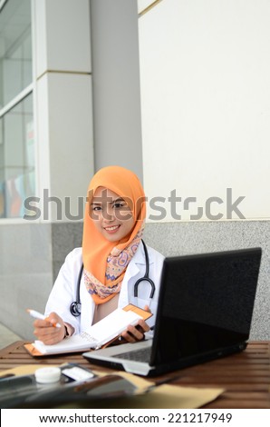 Confident Muslim medical student smile while study at hospital