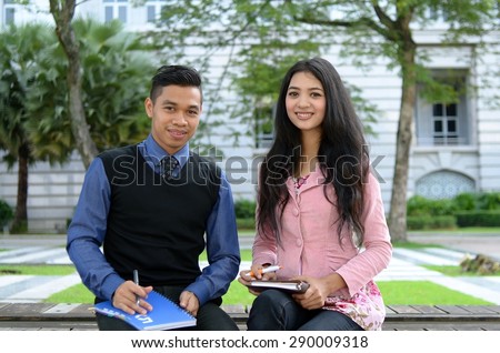 Young asian muslim woman and friend smile and happy meeting together