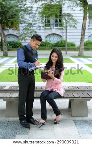 Young asian muslim woman and friend smile and happy meeting together