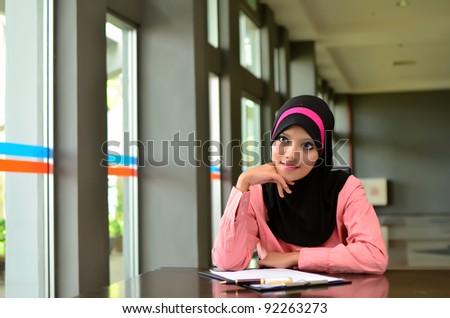 Portrait of beautiful young Asian Muslim student smile