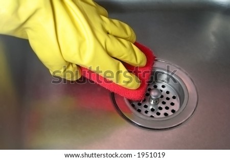 gloved hand cleans